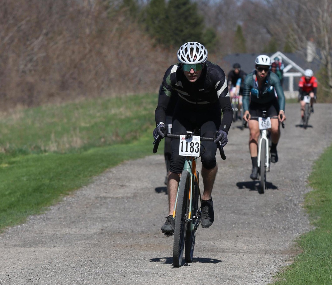 the author riding his bike toward the camera, looking pretty cool