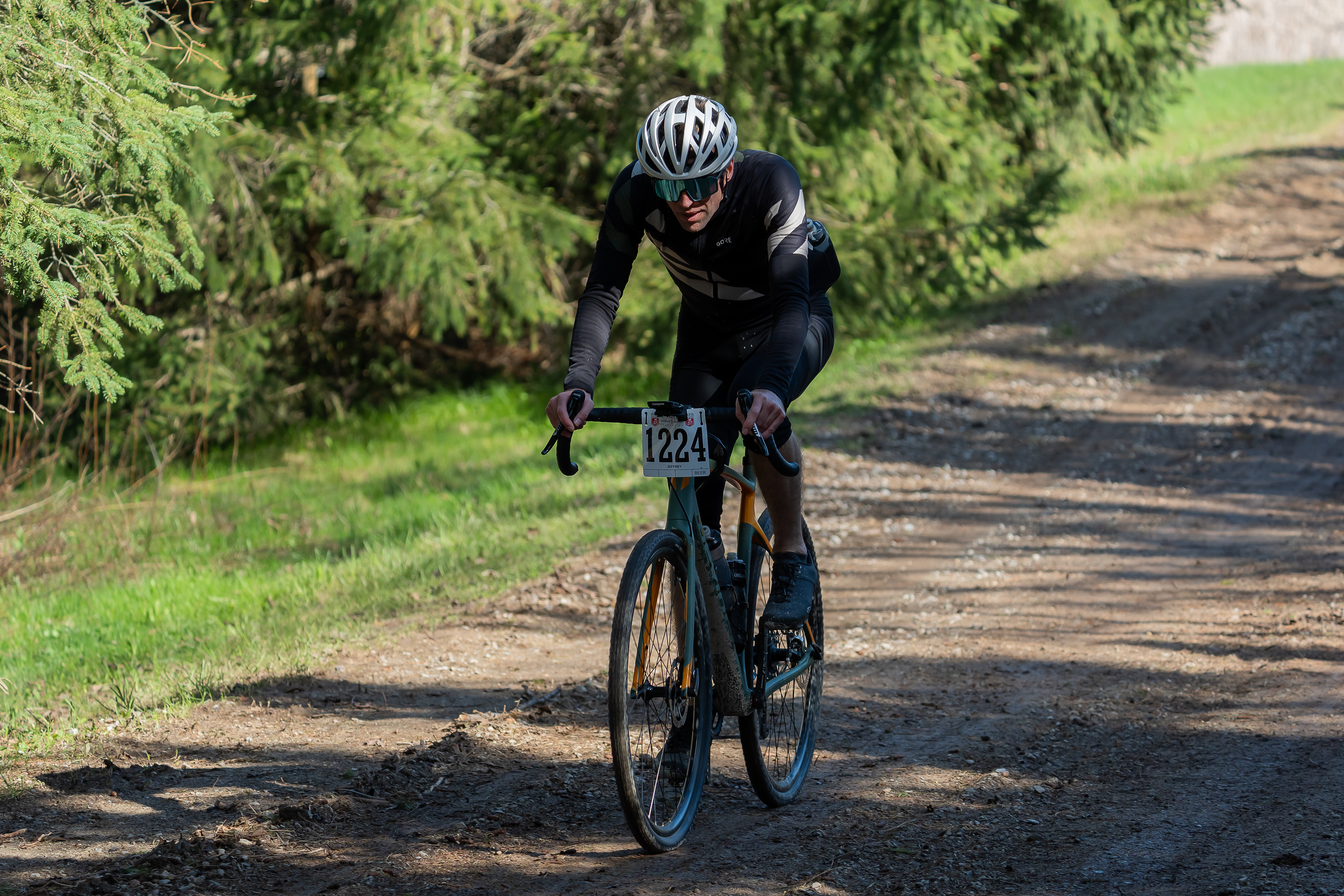 Jeffrey biking on some moist dirt road