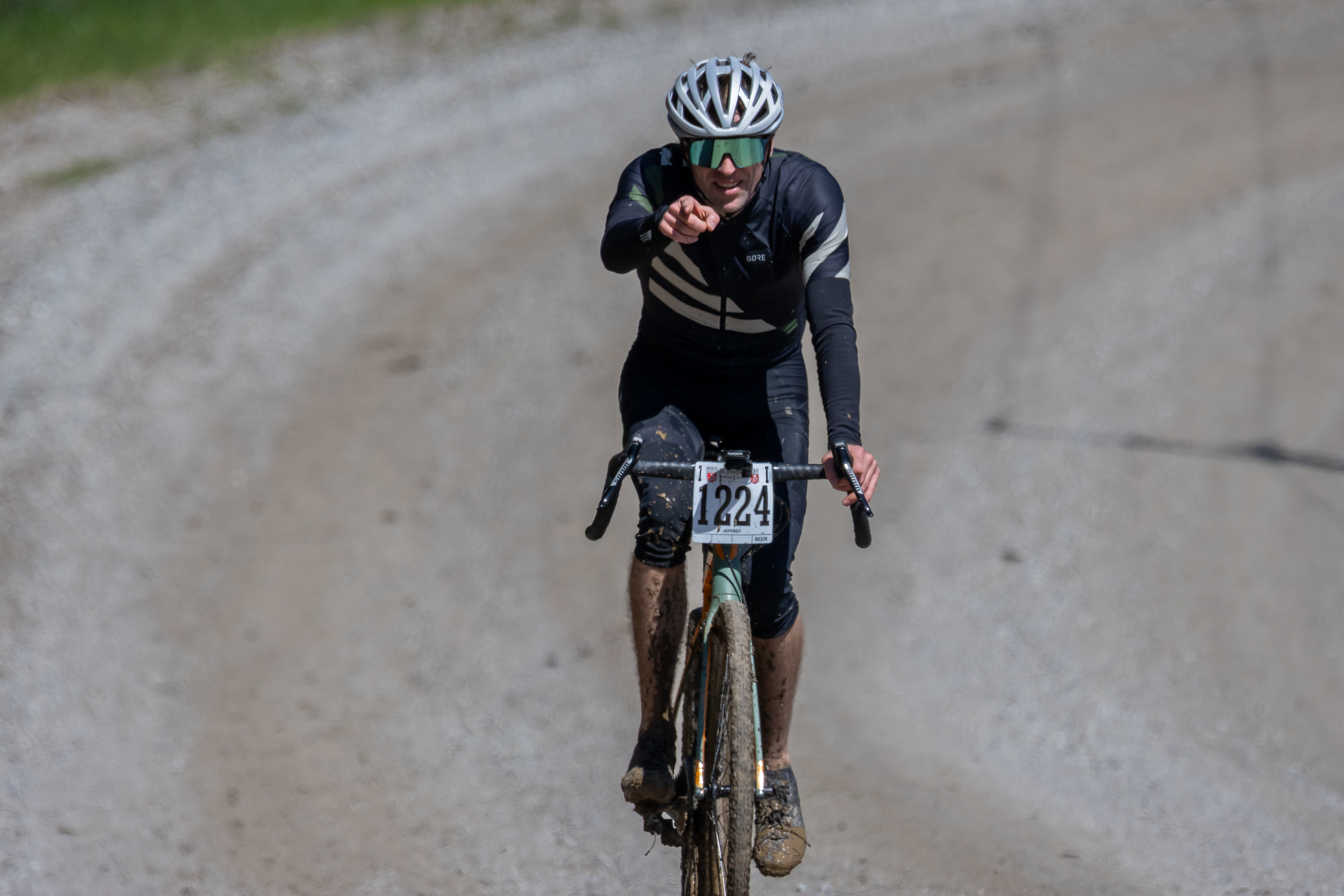 Jeffrey riding up a hill and giving a point