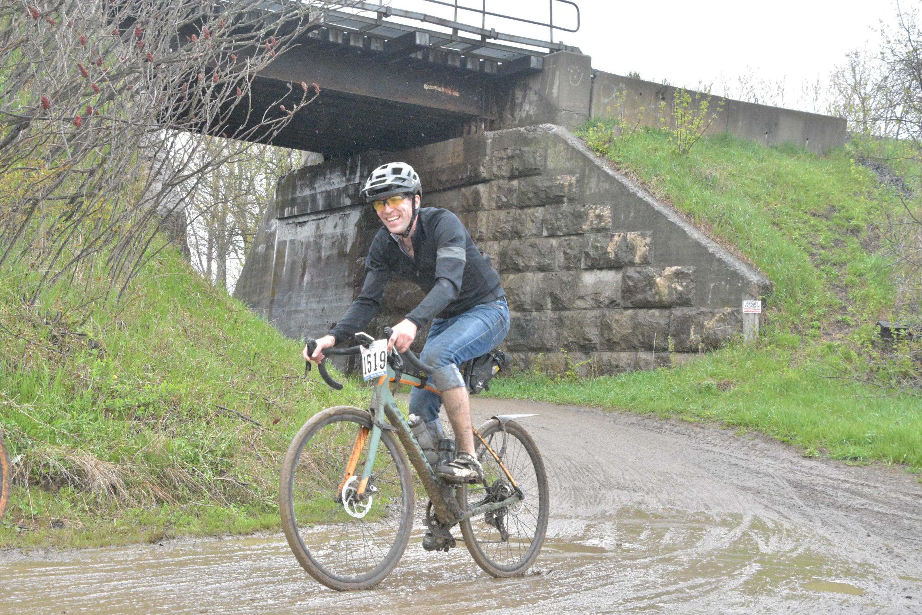 The author slightly muddied after passing beneath a train bridge